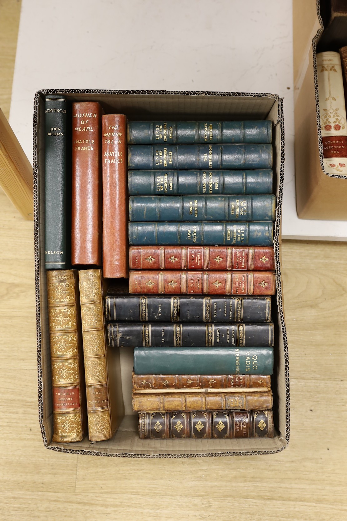 A large quantity of leather bound books including Tracts For The Times, Caroline of Anspach by W.H. Wilkins, Don Quixote, Lives of The Engineers Smile, Pendennis etc.